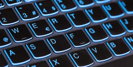 Top view of an extremely close-up computer keyboard keys