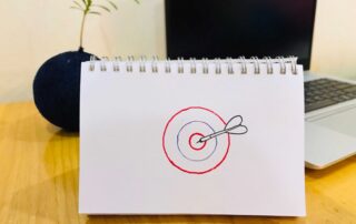 Drawing of a target that has been hit with a dart