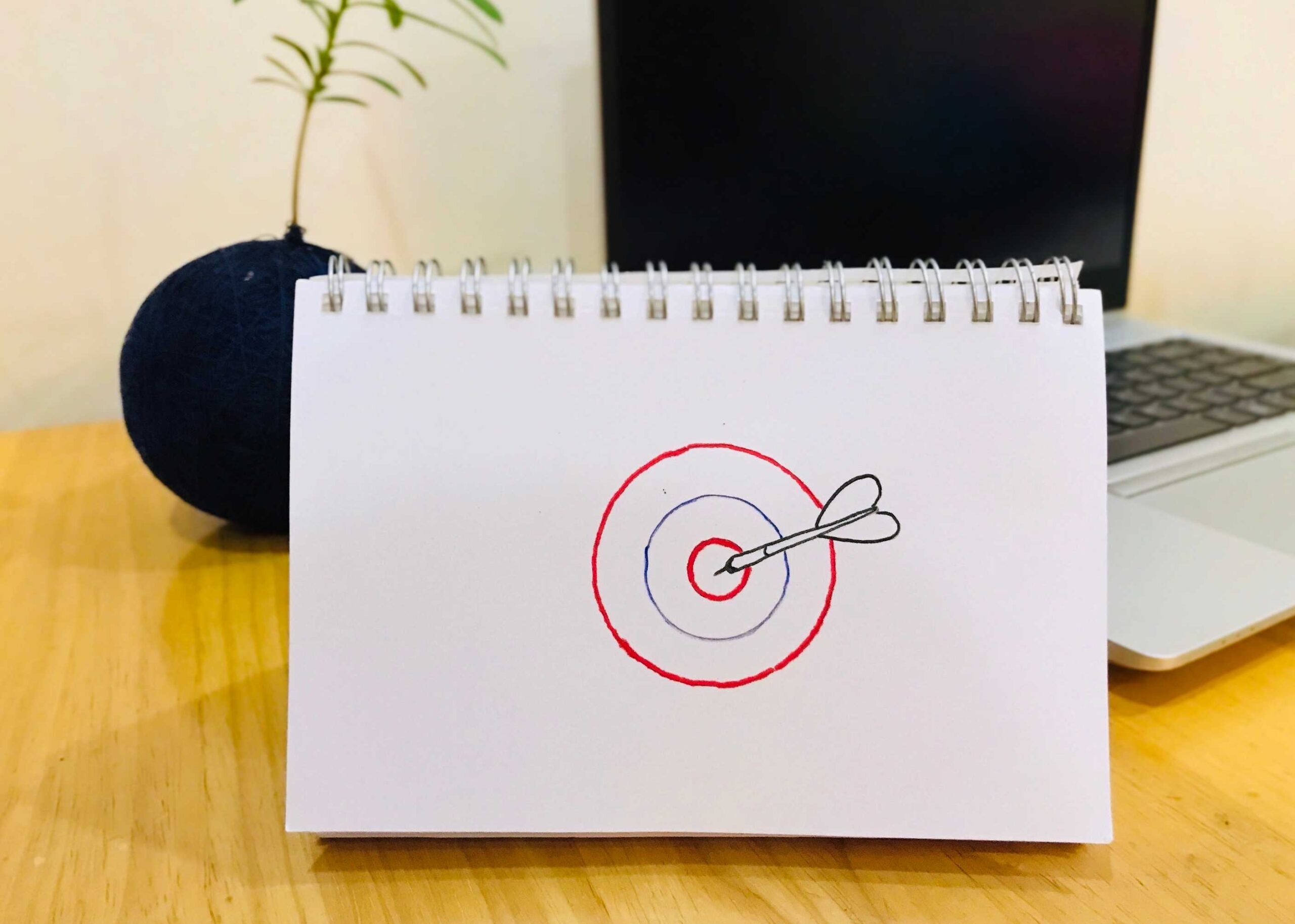 Drawing of a target that has been hit with a dart