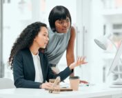 A business administration apprentice getting guidance from her mentor