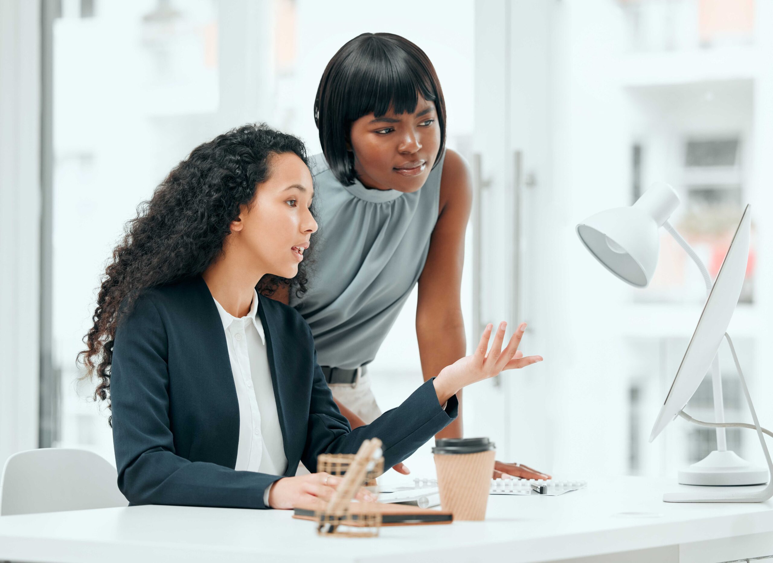 A business administration apprentice getting guidance from her mentor